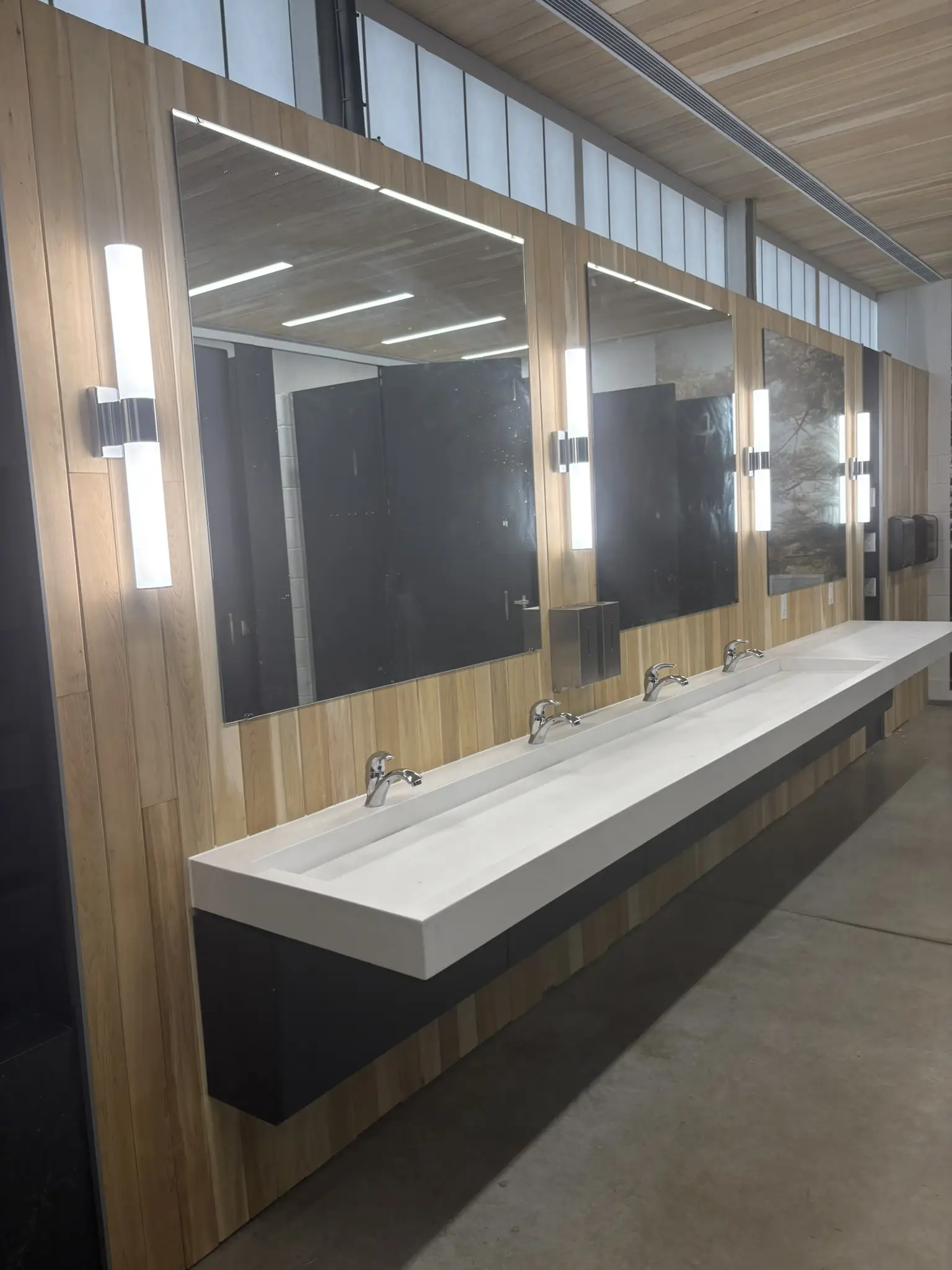 a bathroom with sinks and mirrors