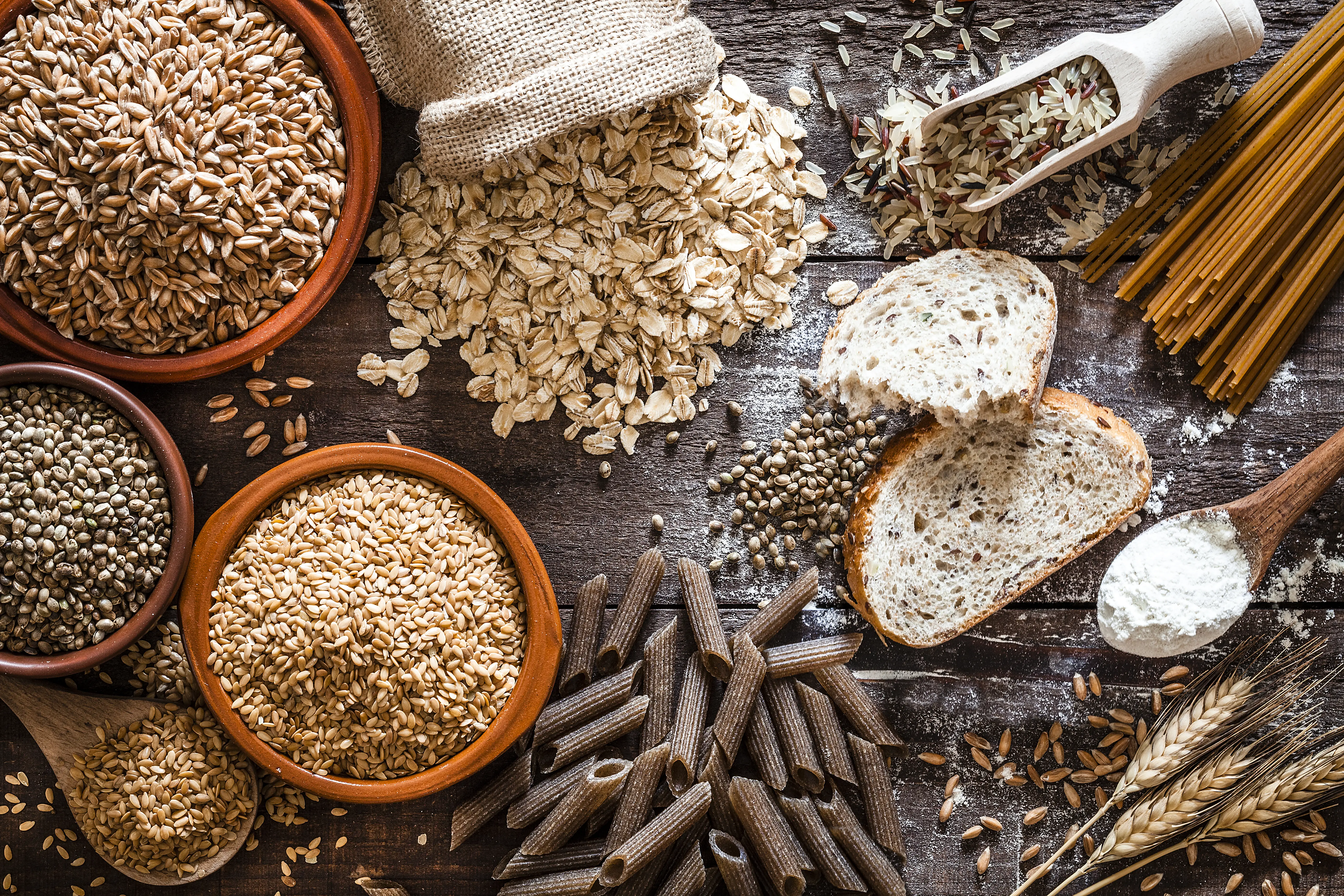 a variety of grains and pasta on a table
