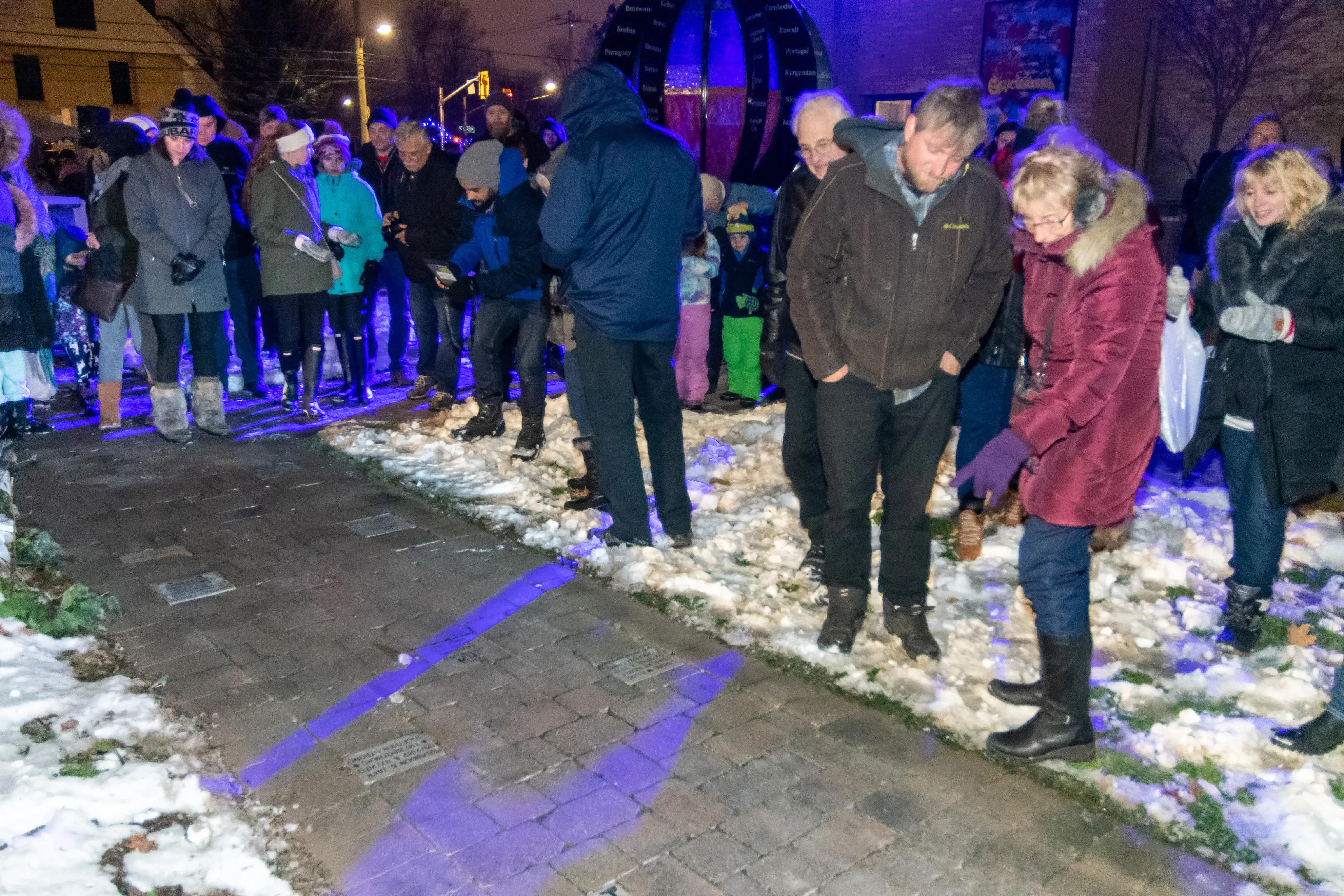 a group of people standing in snow