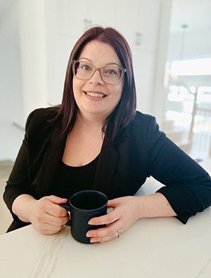 a woman holding a coffee cup