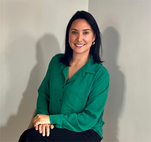 a woman smiling and sitting