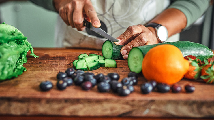 a person cutting vegetables